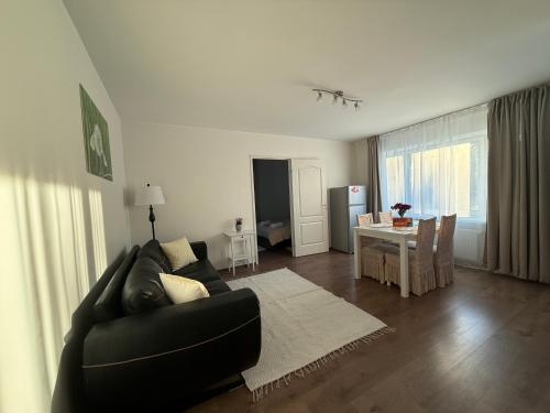 a living room with a couch and a table at Stay in Old Town in Võru