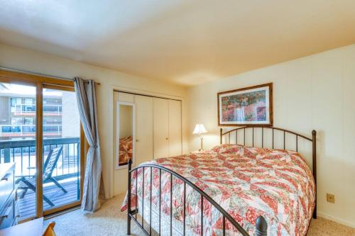 a bedroom with a bed and a balcony at Wild Irishman 1080 in Dillon