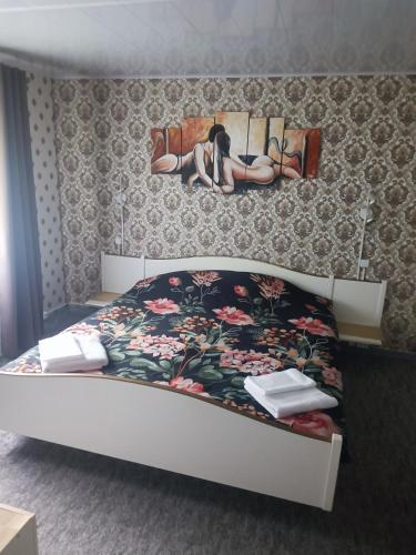 a bedroom with a bed with a dog laying on it at Senja Aurora in Senja