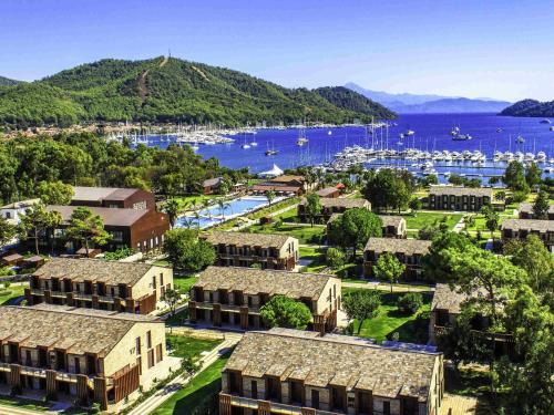 an aerial view of a town with a marina at Rixos Premium Göcek - Adult Only in Göcek