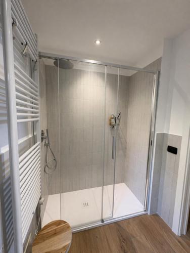 a shower with a glass door in a bathroom at Riviera Panorama Retreat in Alassio