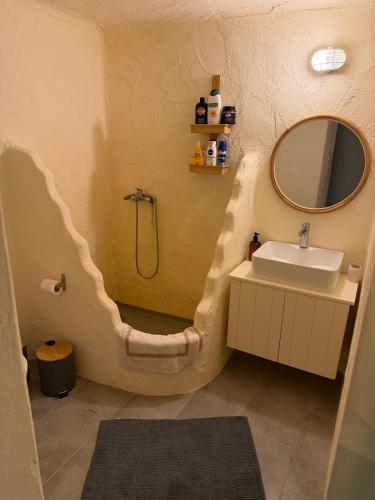 a bathroom with a sink and a mirror at Casa Luca in Drios