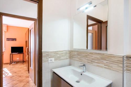 a bathroom with a sink and a mirror at Paola in Villa Faraldi