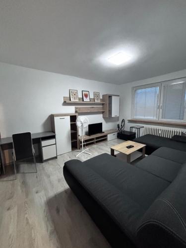 a living room with a couch and a table at 3 room apartment in Trnava