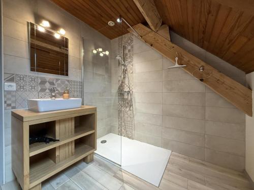 a bathroom with a sink and a shower at Chez escarain in Arette