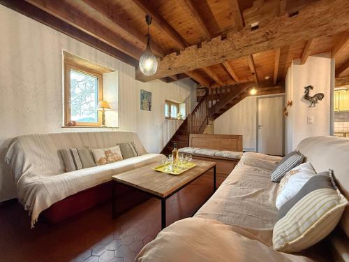 a living room with a couch and a table at Chez escarain in Arette
