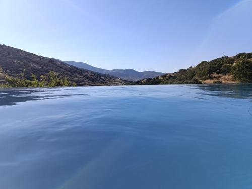 a view of a river with mountains in the background at Celini villa Tinos in Krokos