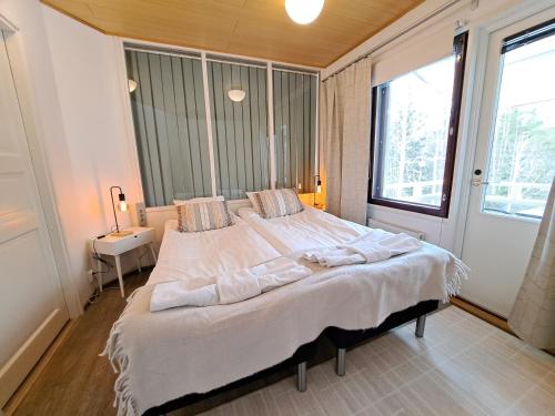 Llit o llits en una habitació de Vilmilä