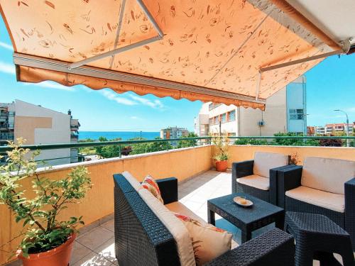 a balcony with chairs and tables and a view of the ocean at Blue Horizon SKG in Thessaloniki