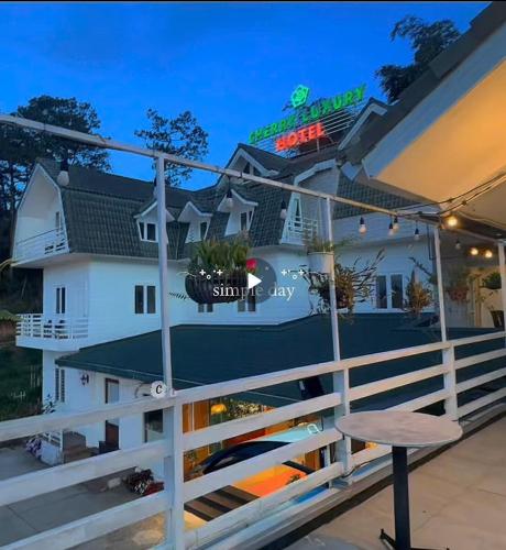 a view of a house from the balcony at night at Cherry Luxury Hotel in Da Lat