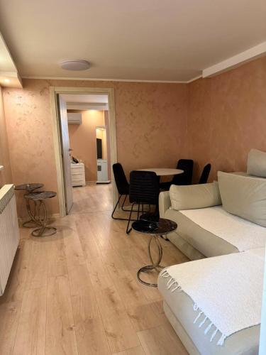 a living room with a bed and a table at Silver Night in Belgrade