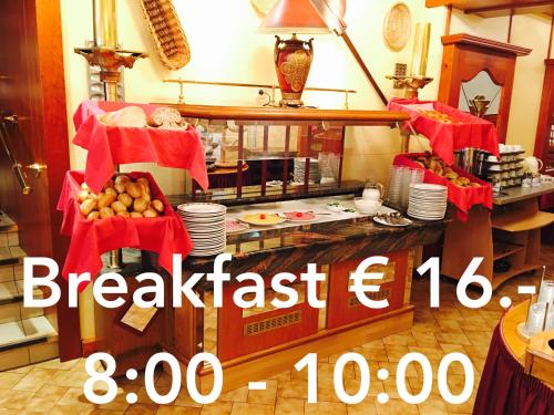 a breakfast counter in a kitchen with food on display at Bed & Breakfast du Château - Breakfast not included in Vianden