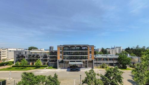 an office building in a city with a parking lot at Hotel Longosa - All Inclusive Family Hotel near the beach in the peaceful southern part of Sunny Beach in Sunny Beach