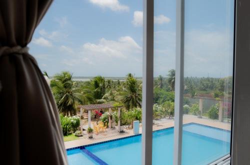 a view of a pool from a hotel room at Pousada Itarema Residence in Itarema