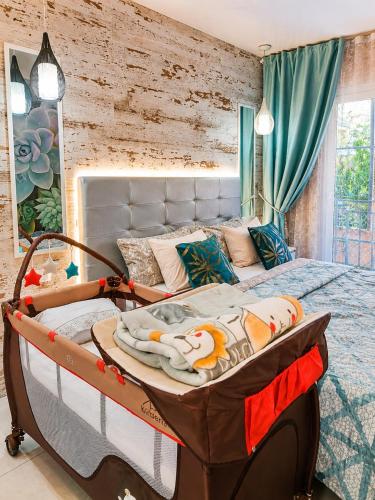 a bedroom with a large bed in a room at ORLANDO LUXURY APARTAMENT in Adeje