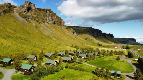 a village on the side of a mountain at Hörgsland Cottages in Hörgsland