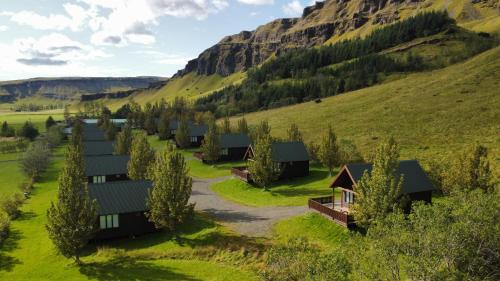 an aerial view of a village in the mountains at Hörgsland Cottages in Hörgsland