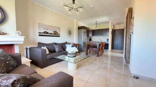 a living room with a couch and a table at Casa De Sol by Horizon Homes in Ofrínion