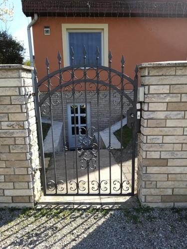 a gate in front of a house at Magdaléna Vendégház in Esztergom