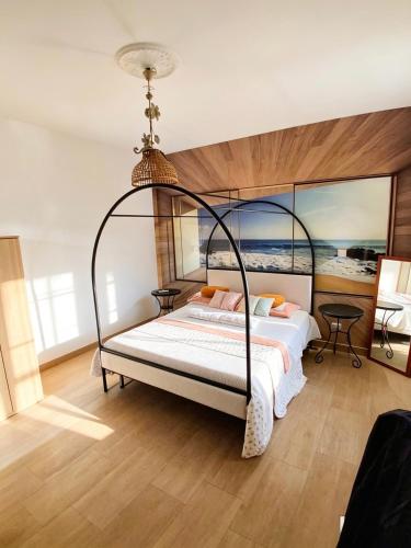 a bedroom with a bed with a metal canopy at the Lighthouse accommodation in Taranto