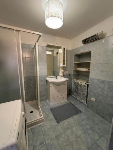 a bathroom with a sink and a shower at Casa Ravasio in Arcevia