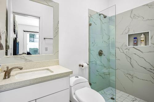 a bathroom with a sink and a shower at Dog-friendly home 3 rows to beach with rooftop deck, pool, hot tub, & kitchen in Rosarito