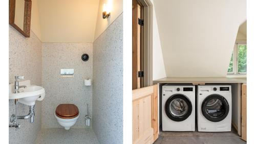 a bathroom with a washing machine and a sink at Bakkumer Strand in Castricum