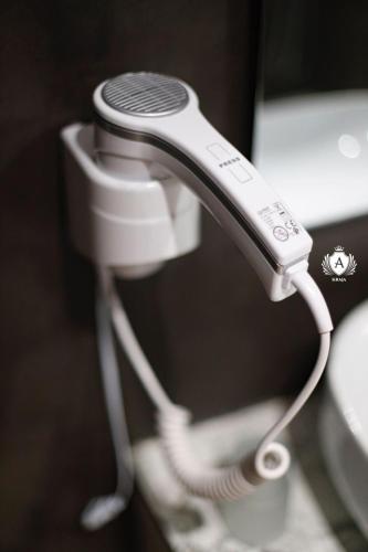 a close up of a white hair drier at Hotel Kraja in Golem