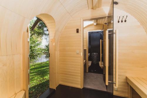 an internal view of a tiny house with an archway at Gut Damp Ferien Lofts in Damp