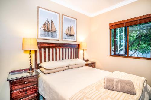 a bedroom with a bed and a window at Avemore Island Apartment Sedgefield in Sedgefield
