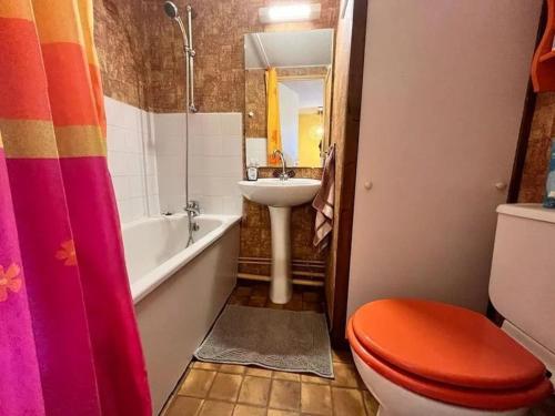 a bathroom with a toilet and a sink at Bret in Valras-Plage