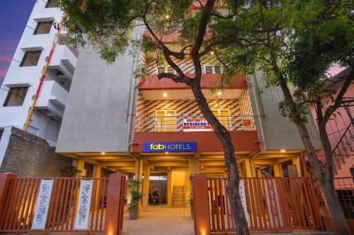 a building with a sign on the front of it at FabHotel Infinity Residency in Pune