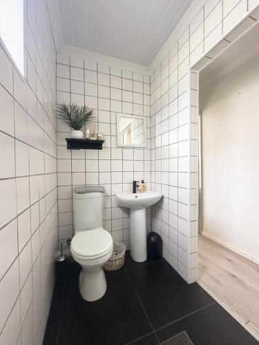 a bathroom with a toilet and a sink at Romantic Tulbagh Getaway in Tulbagh