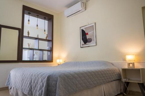 a bedroom with a bed and a window at HYGGE FORMOSA in Formosa