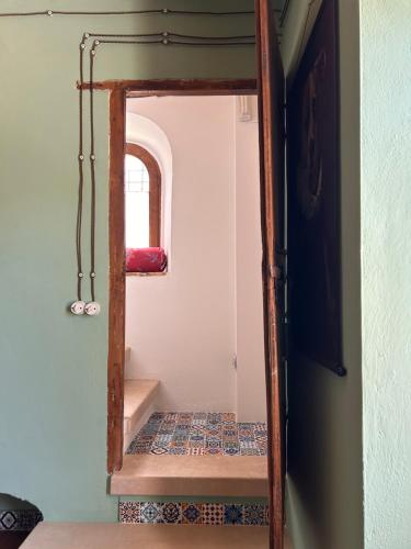 an open door to a room with a stairway at Civico 15 in Antrosano