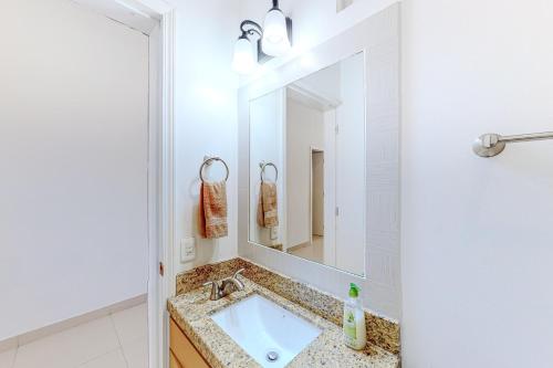 a bathroom with a sink and a mirror at Dog-Friendly Villa with Heated Outdoor Pool, Hot Tub, Streaming, Balcony, Grill in Rosarito