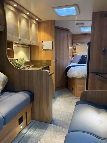 a small room with a bedroom and a bed at Cefn Farm - Hyssington Heights in Hyssington
