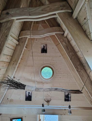 a window in the ceiling of a tiny house at La chaumière ensorcelée in Anor