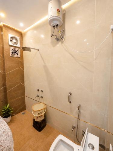 a bathroom with a sink and a toilet at Hotel Prabh Aasra Near Shree Ram Mandir in Ayodhya