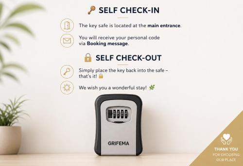 a self check in device on a table with a plant at Urban Stay Kremsmünster Studio in Kremsmünster