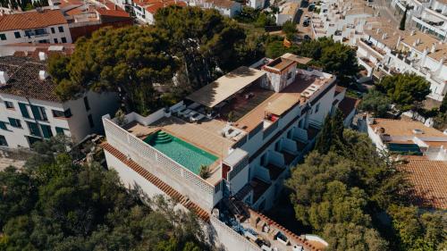 an aerial view of a building with a swimming pool at Hotel Cadaqués1962 by Fimedhotels in Cadaqués