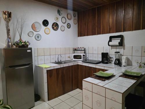 a kitchen with a sink and a refrigerator at Apartamento Rustico in Fortuna