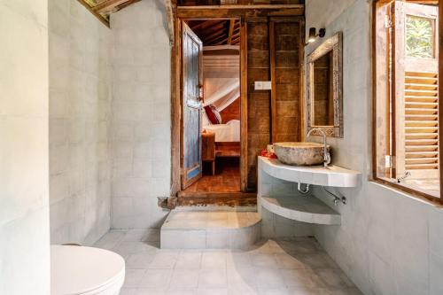 a bathroom with a sink and a toilet at Green labak 2 in Silebeng