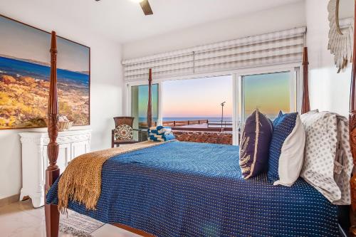 a bedroom with a bed with a view of the ocean at Dog-Friendly Ocean-view Villa with Patio, Outdoor Pool, Streaming, partial AC in Rosarito
