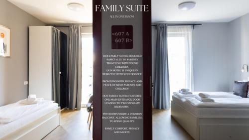 a sign in a room with two beds in a room at Di Verdi Imperial Hotel in Budapest