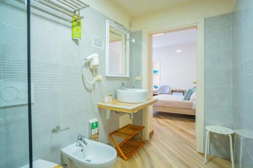 a bathroom with a sink and a toilet at Salento Ada's House in Melendugno