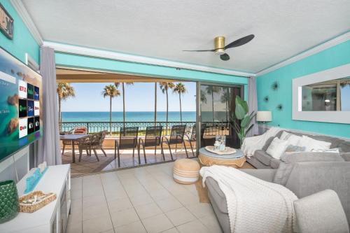 a living room with a view of the ocean at Sonoran Spa Amazing Oceanfront E206 in Puerto Peñasco
