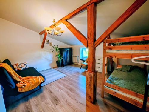 a bedroom with a bunk bed in a room at Wczasy z Wędką in Gardna Wielka