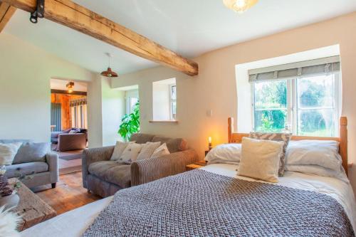 a bedroom with a bed and a living room at 1 Bed in Bream oc-m43316 in Bream