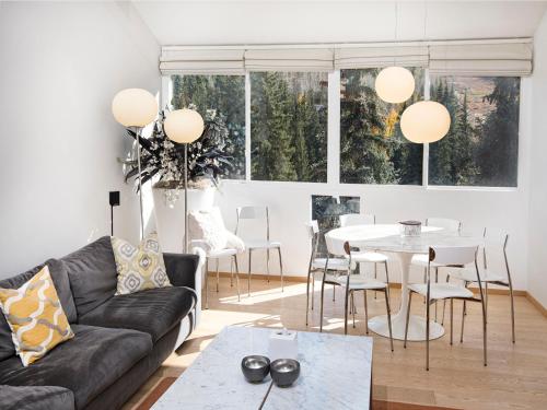 a living room with a couch and a table at Lionshead Center in Vail